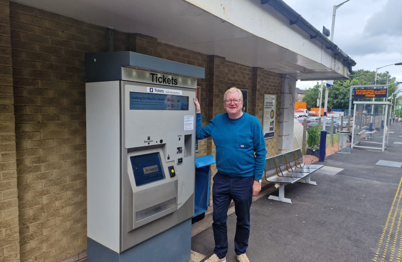 Eastwood MSP Jackson Carlaw standing by the new ticket machine at Giffnock station